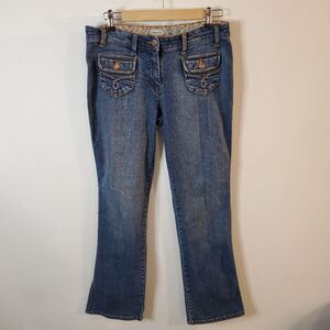 Juniors stretch jeans with bejeweled pocket buttons